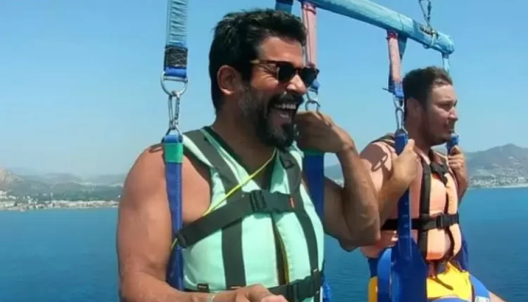 شاهد بالصور | بوراك أوزجيفيت يتغلب على خوفه ويجرب الطيران الشراعي